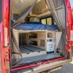 el-monte-class-b-small-rv-4-berth-interior-back-door-open-bed-down